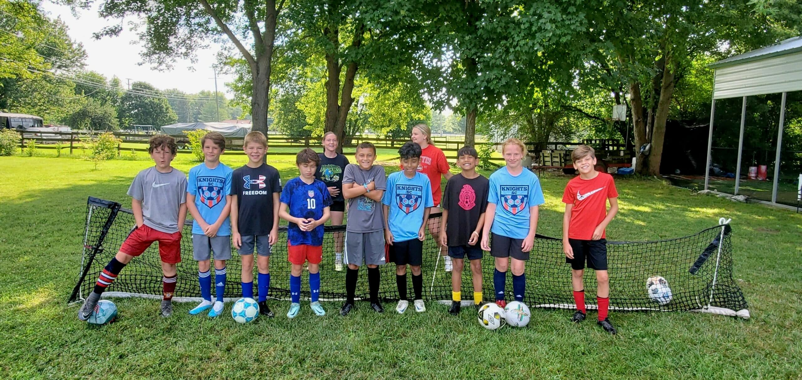 Youth soccer players gathered after a Blount training session